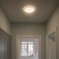Preview: Flache LED-Deckenleuchte Oja 24cm mit Lichtkranz an der Decke für ein modernes Wohnambiente