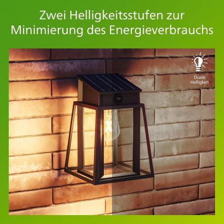 Philips Solar Wandleuchte Lysin in Schwarz mit Bewegungssensor UltraEfficient in klassischer Laternenform - 2700K warmweißes Licht, austauschbare Solarlampe